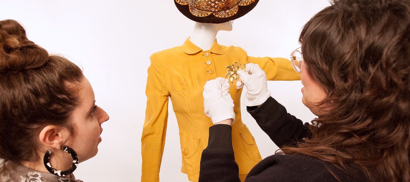 Professor and student styling a fashion piece 